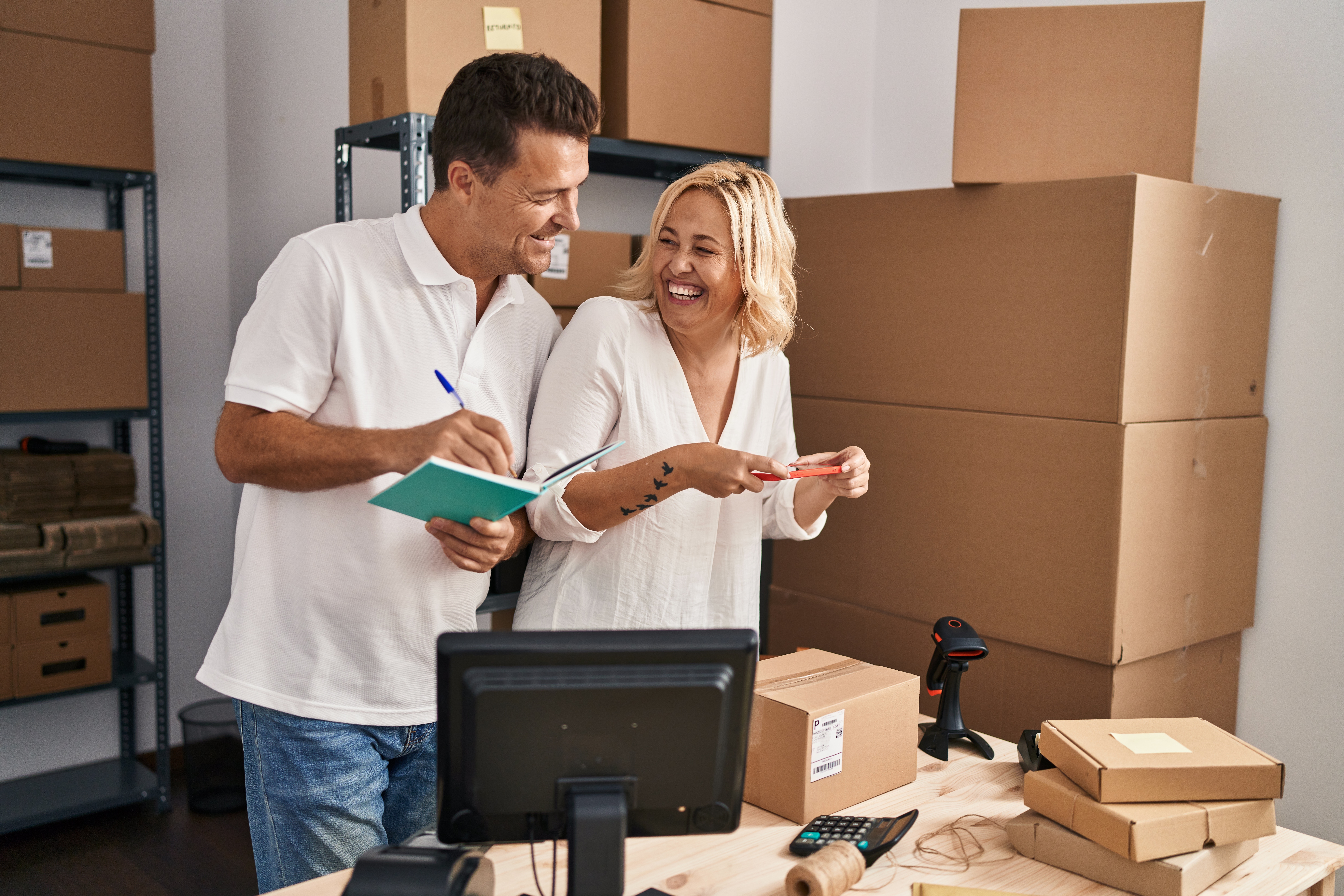 Middle,Age,Man,And,Woman,Business,Partners,Scanning,Label,Using
